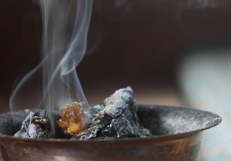 close up photo of gray round bowl with fire