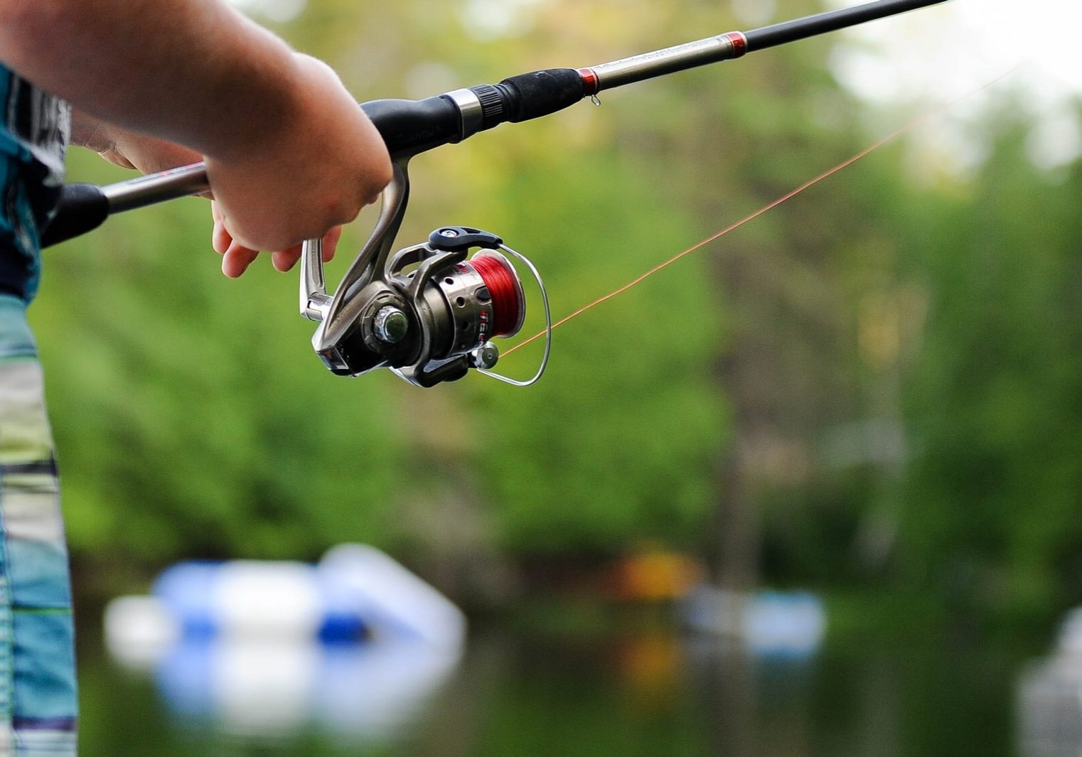 person holding fishing reel